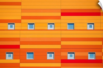An modern building decorated with bright orange stripes