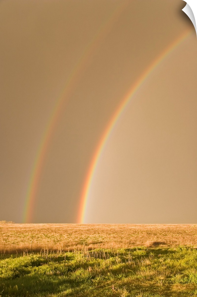 Double rainbows on the backside of a thunderstorm in Tornado Alley.