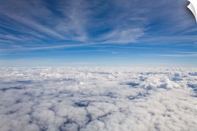 Just above the clouds, the sky split into blue and white layers