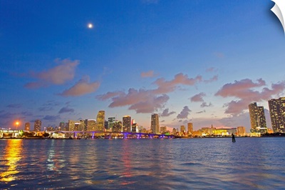 The full moon over Miami's skyline at dusk