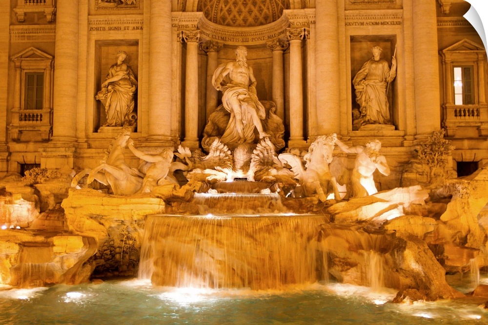 The Trevi Fountain illuminated at night.