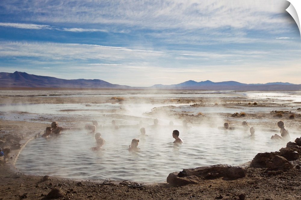 Tourists enjoying natural hot springs in Bolivia's altiplano.
