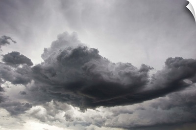 Underneath a supercell thunderstorm with dark and eerie storm clouds