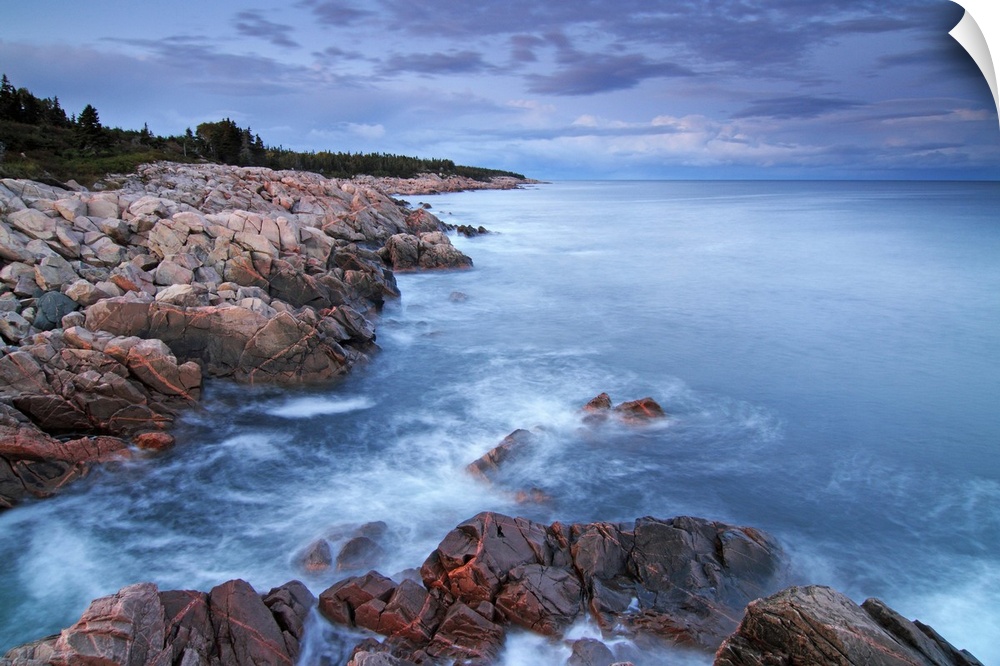 View of the Atlantic ocean from the rocky coast at the Cape Breton Highlands National Park in Nova Scotia, Canada.
