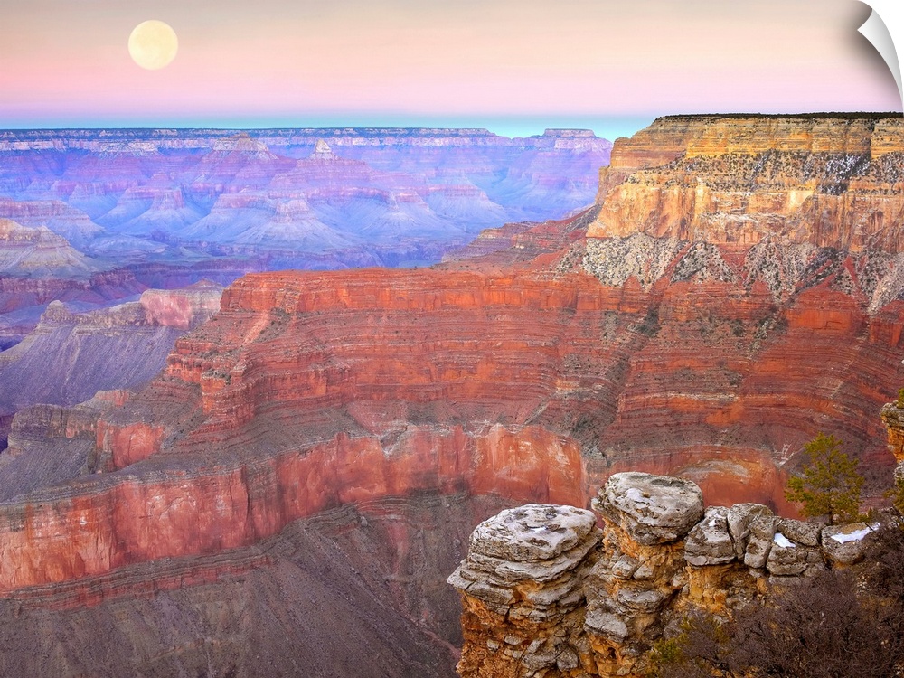 Amazing landscape photograph of the famous Southwest American canyon the captures a wide variety of colors and a full moon...