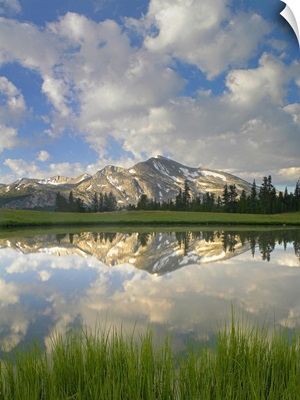 Mammoth Peak and scattered clouds reflected in lake, Yosemite National Park, California