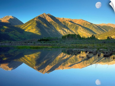 Moon and Twin Peaks reflected in lake, Colorado