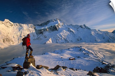 Mt Sefton, climber above Mueller hut and cloud filled Mueller Glacier, New Zealand