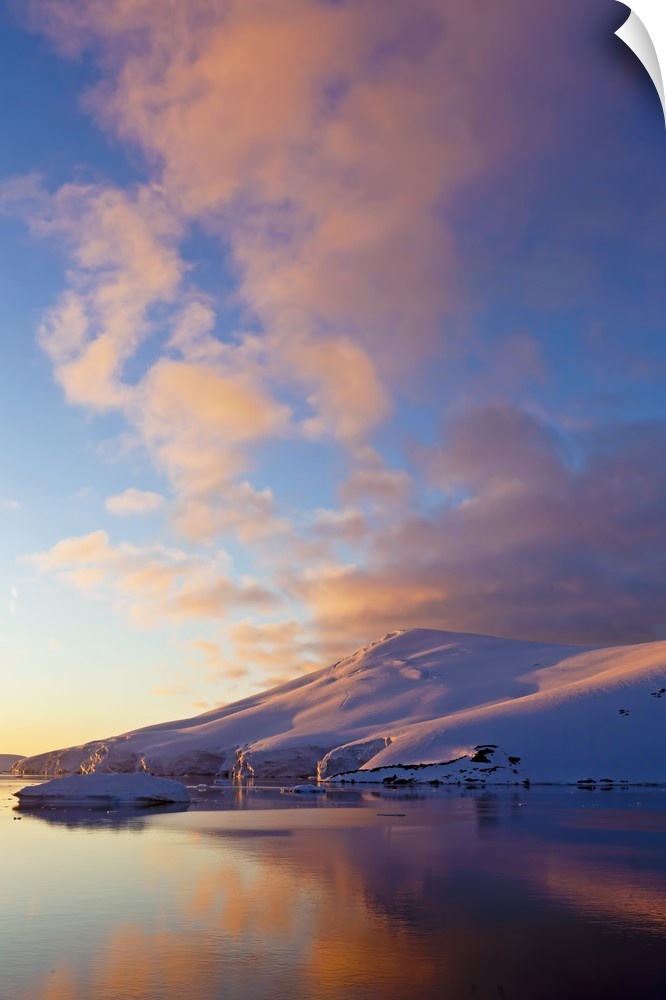 Sunset over coastal mountains, Lemaire Channel, Antarctica.