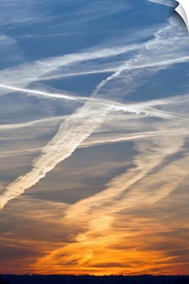 Vapor trails from airplanes at sunset, Germany