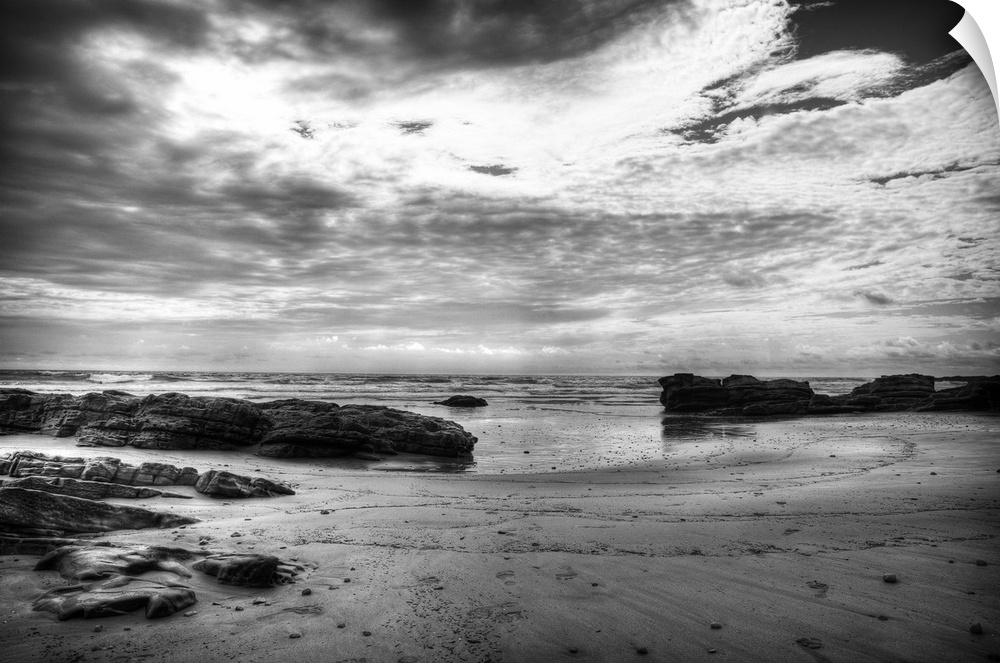 Black and white photograph of a dramatic coastal scene.