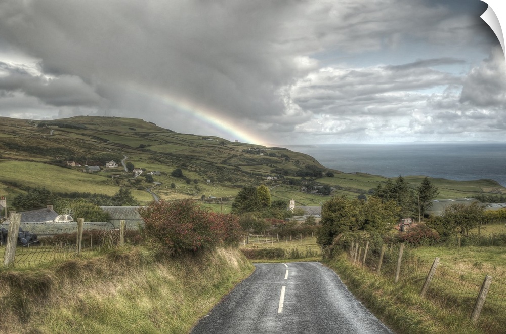 A photograph looking down the road of a countryside landscape in Northern Ireland.