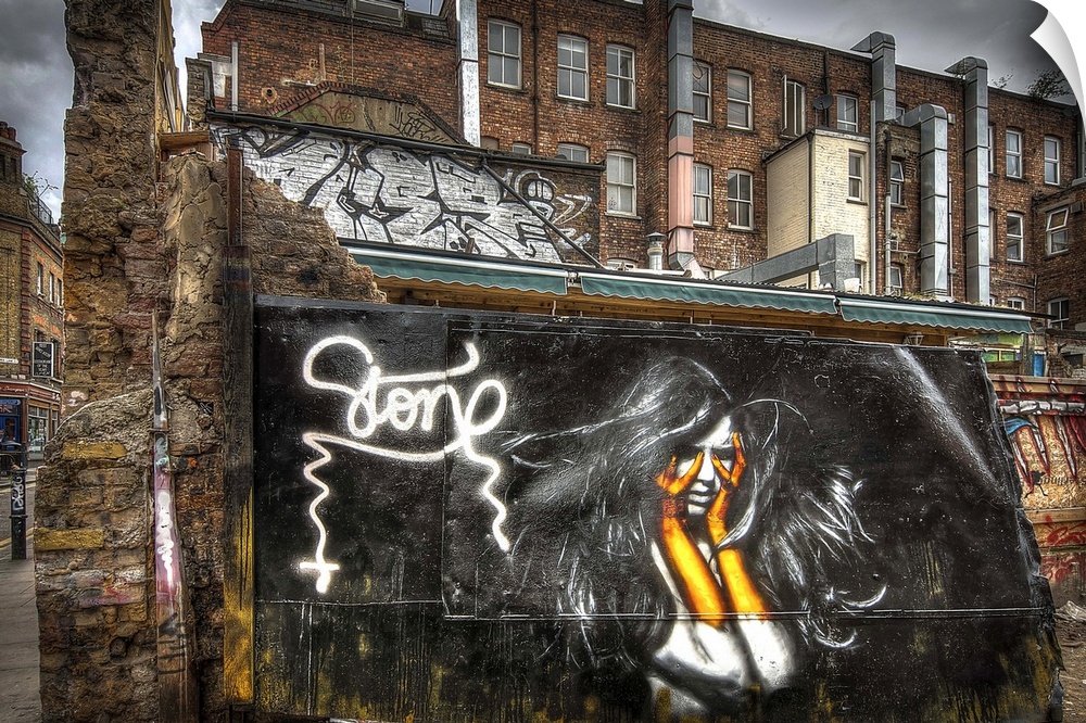 Fine art photograph of a graffiti on the facade of a city building.