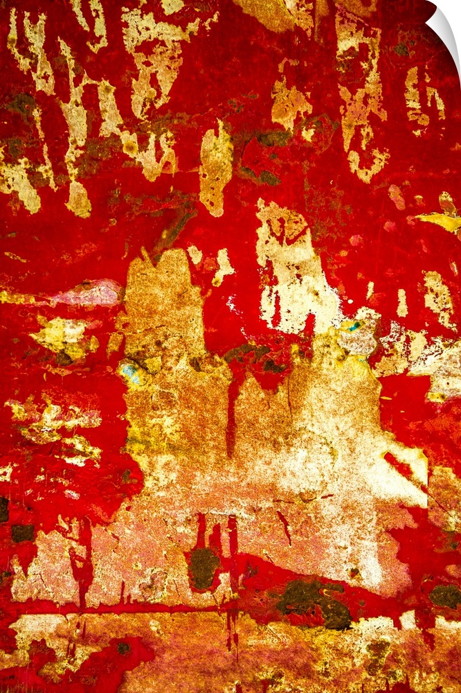 Close up of graffiti on a wall, creating an abstract image in red and gold.
