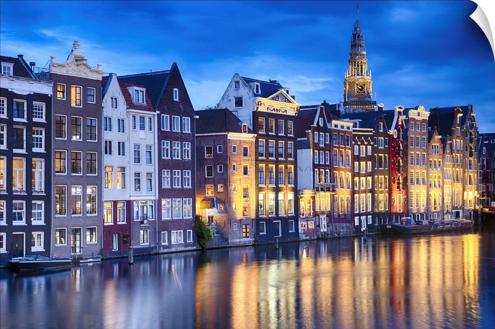 Amsterdam Illuminated at Dusk with the Oude Church in The Background, North Holland, The Neherklands