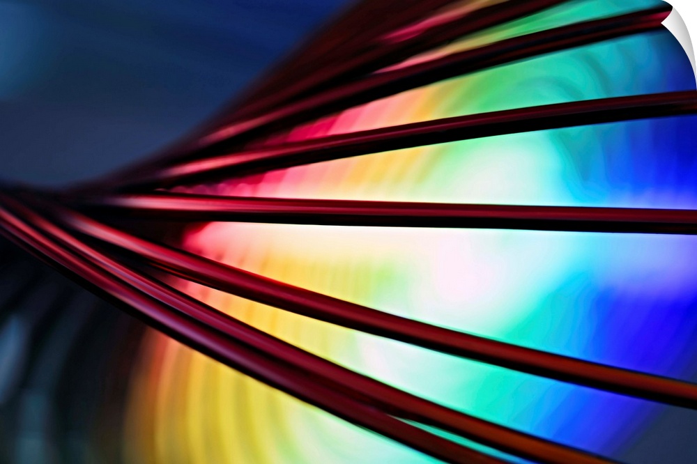 Fine art abstract photograph of cords in front of a rainbow pattern.