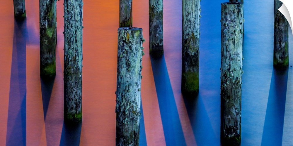 Pilings and harbor lights in Astoria, Oregon.