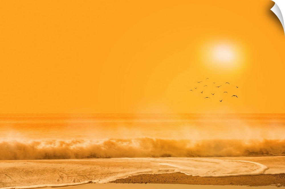 A photograph of a beach scene under an orange sky.