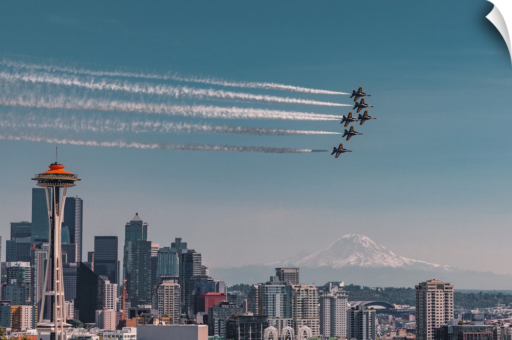 Blue Angels air show over Space Needle in Seattle with Mt Rainier in the background.