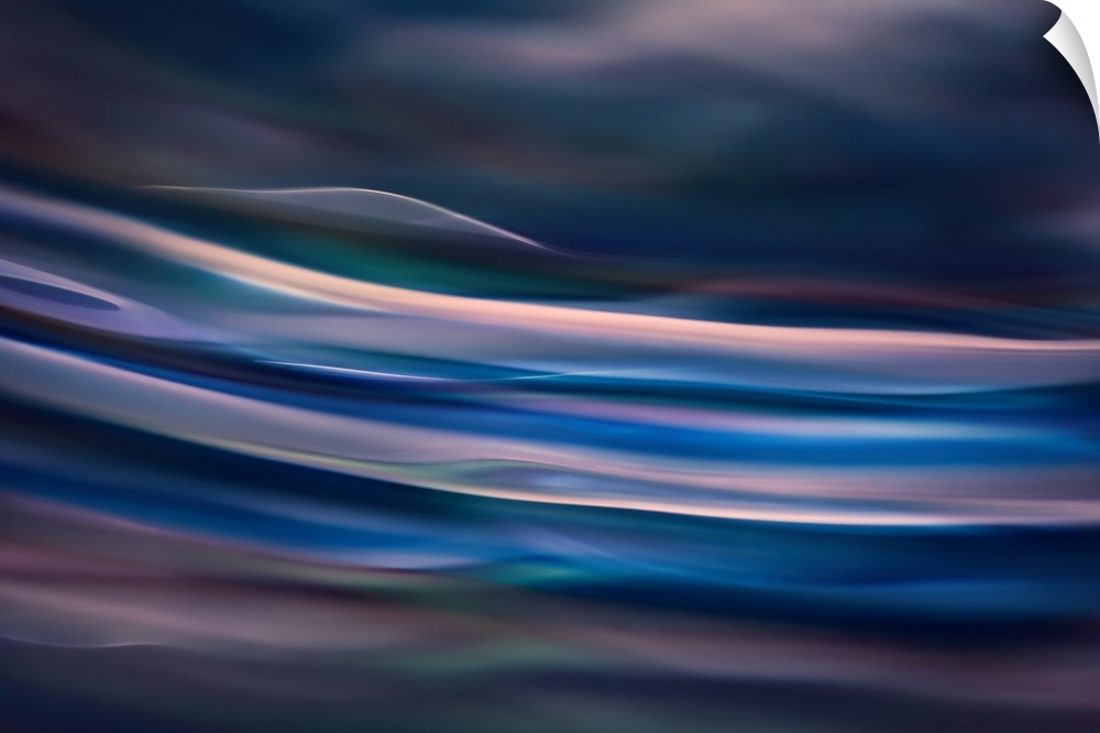 Abstract photograph of blurred and blended colors and flowing lines in shades of blue.