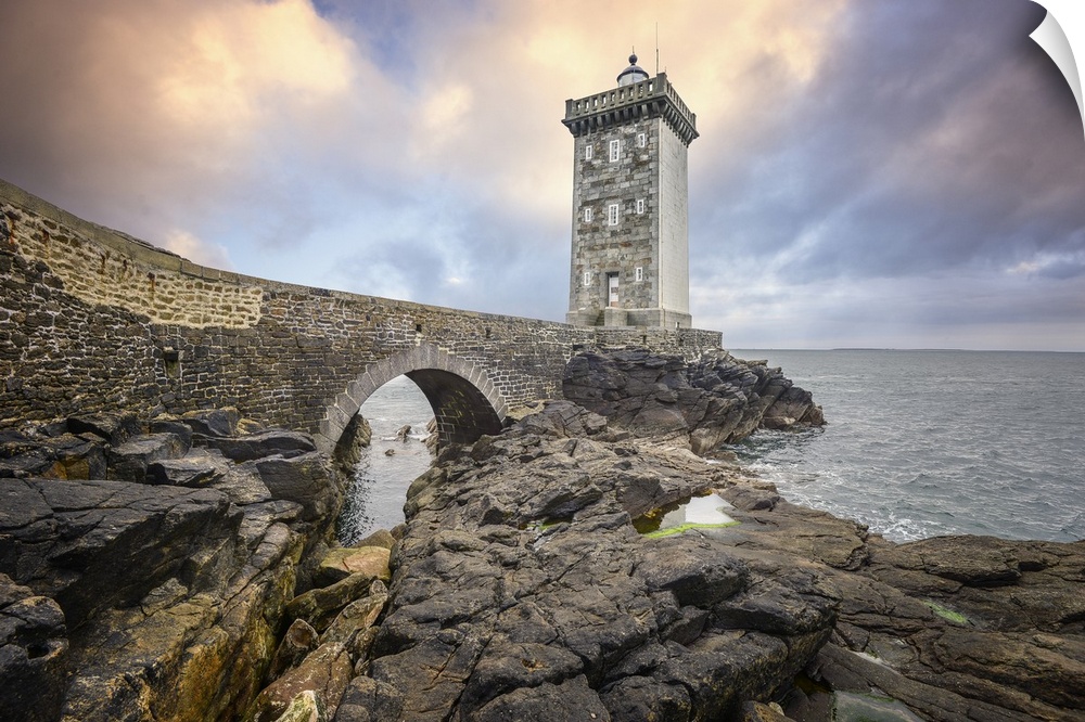 Lighthouse on a rocky coast in France.