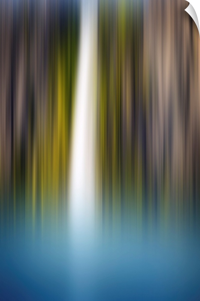 Abstract photograph of a blurred waterfall with brown, green, blue, and white hues.