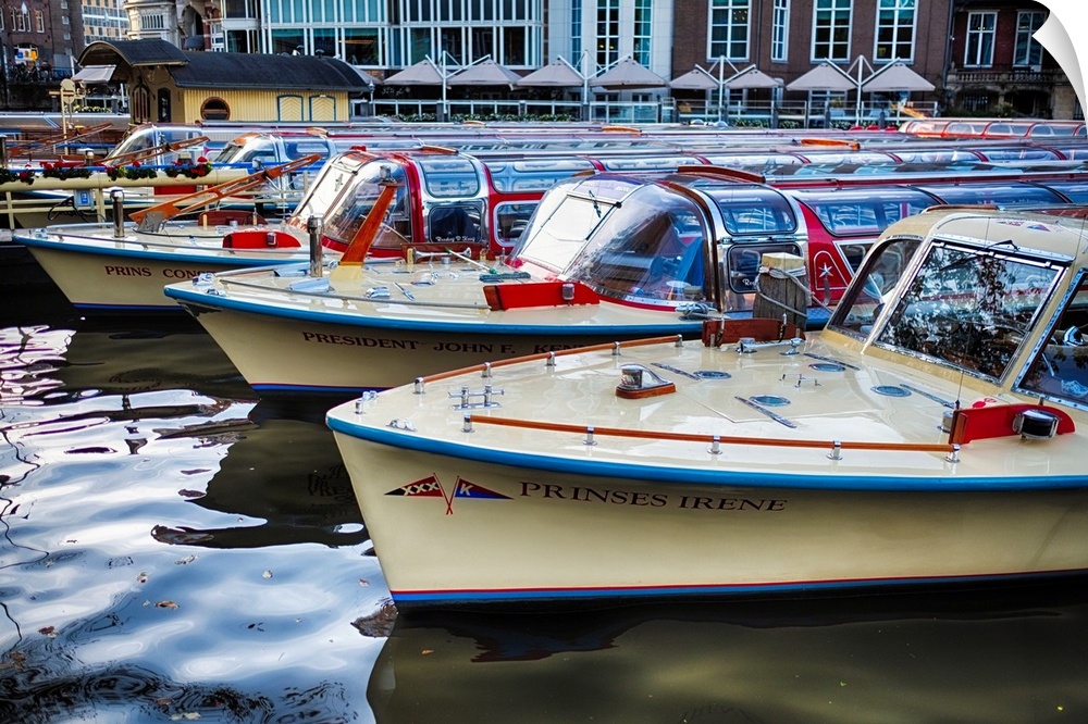 Classic motorboats lined up in a pier, Amsterdam Netherlands.