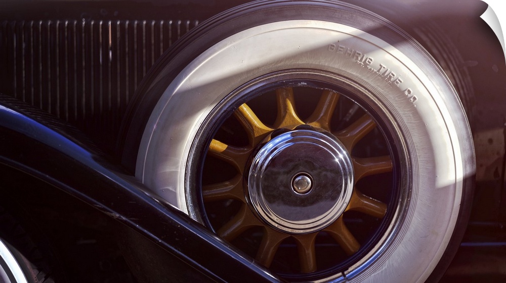 Close Up View of a Woddeen Spoked Spare Wheel with Whitewall Tires of an Antique Automobile