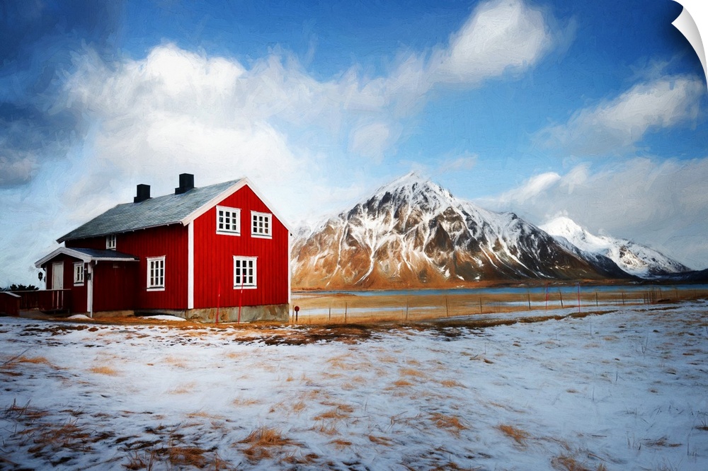 A photograph of a mountain landscape with a red house in the foreground of the image.