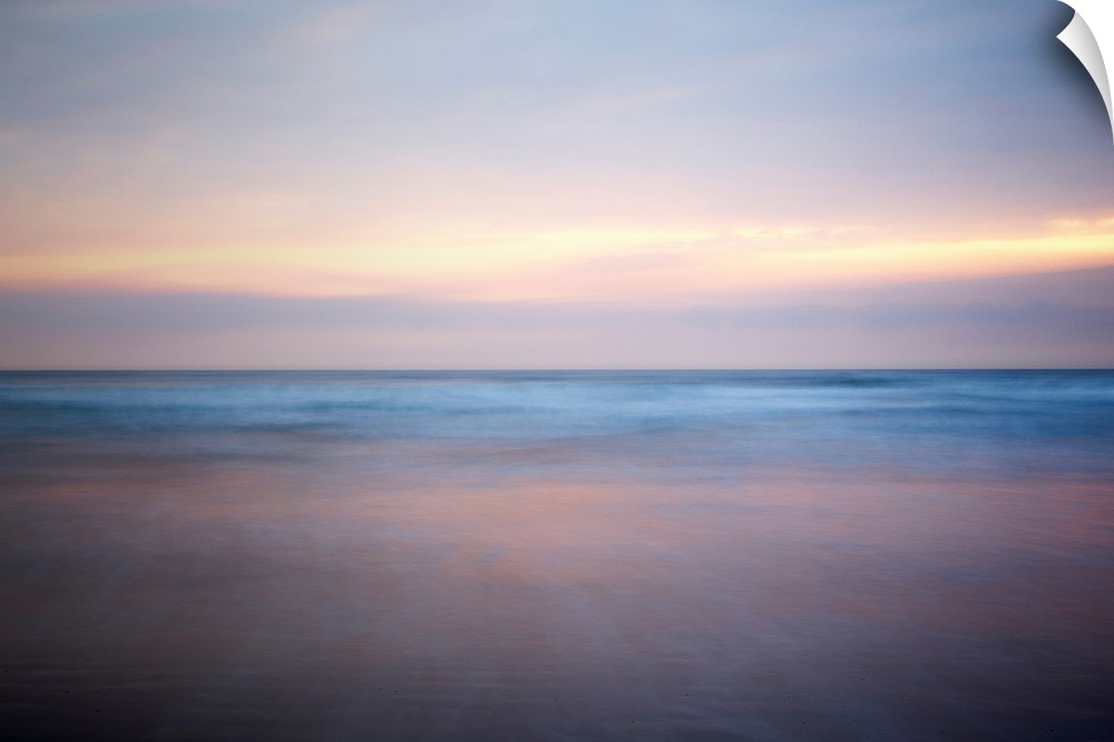 An abstract fine art photograph of a sunrise that has a soft and blurred appearance.