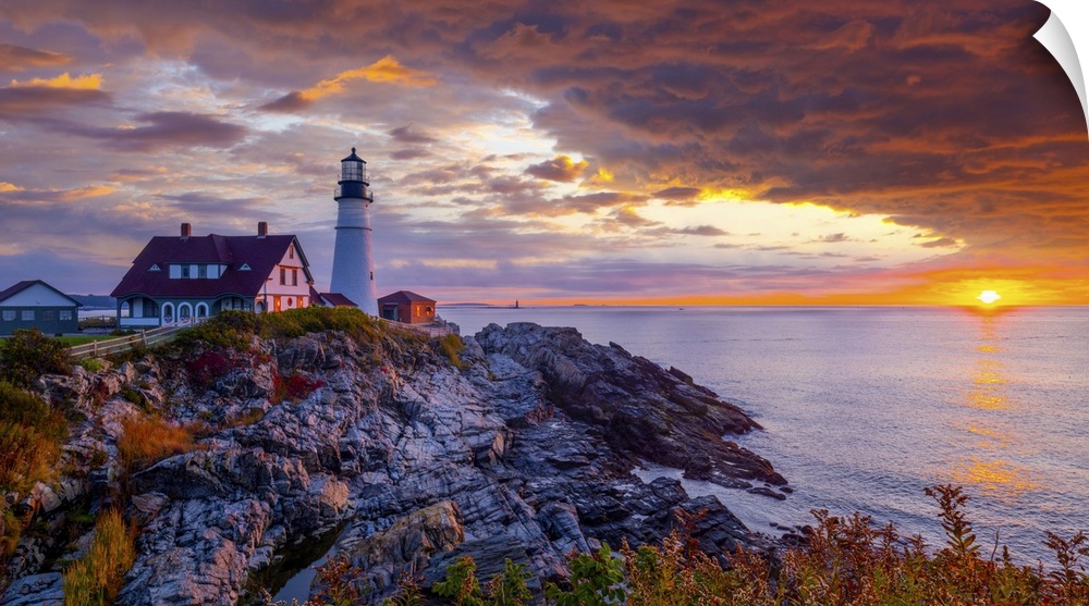 Portland Head Light is a historic lighthouse in Cape Elizabeth, Maine. A wonderful sunrise with intense red colors and a f...