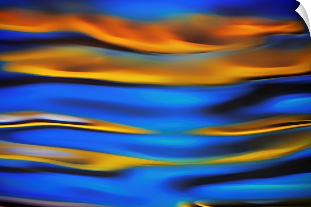 Surreal landscape with waves of reflecting color in yellow, blue, and black.