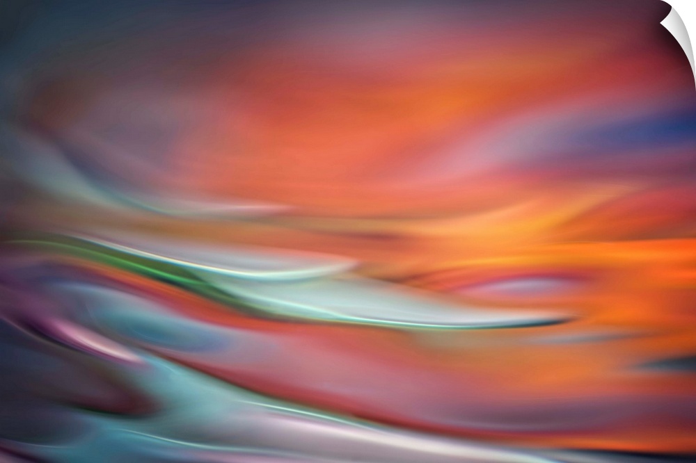 Abstract photo of smooth waves in warm, fiery tones.
