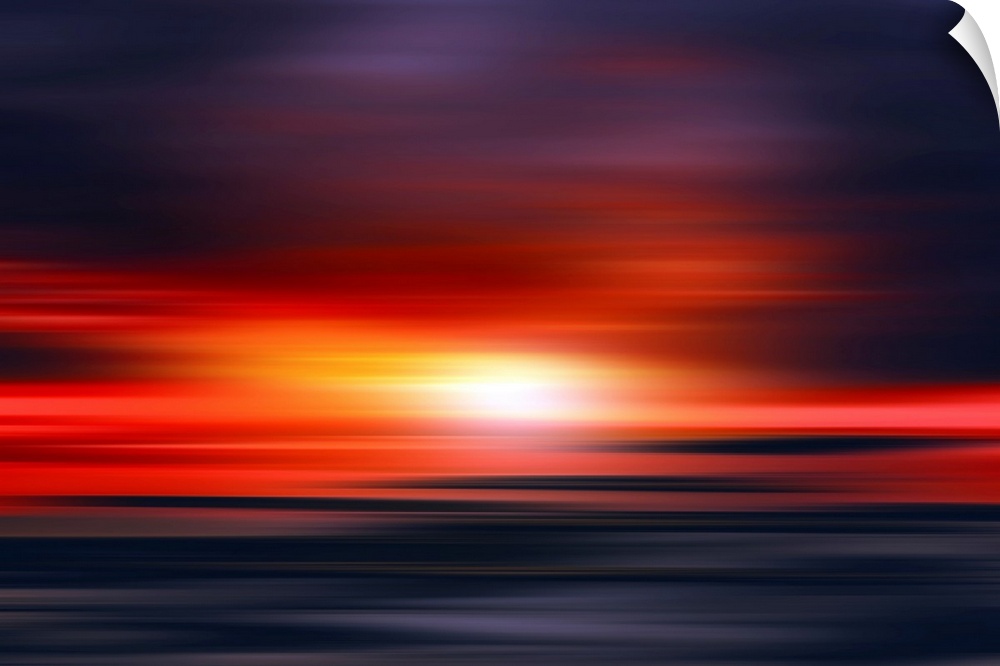 Abstract photograph of a bright red sunset with contrasting dark purple and blue hues above and below.