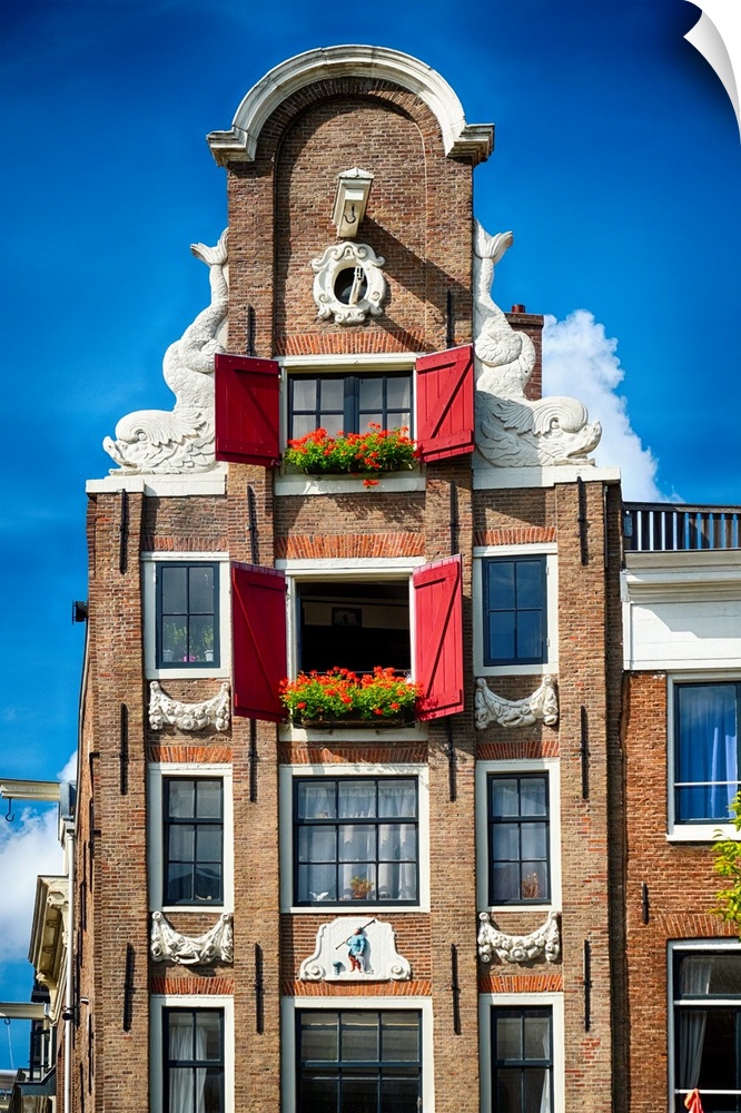 Low angle frontal view of an Old Typical Dutch House, Amsterdam, North Holland, Netherlands.