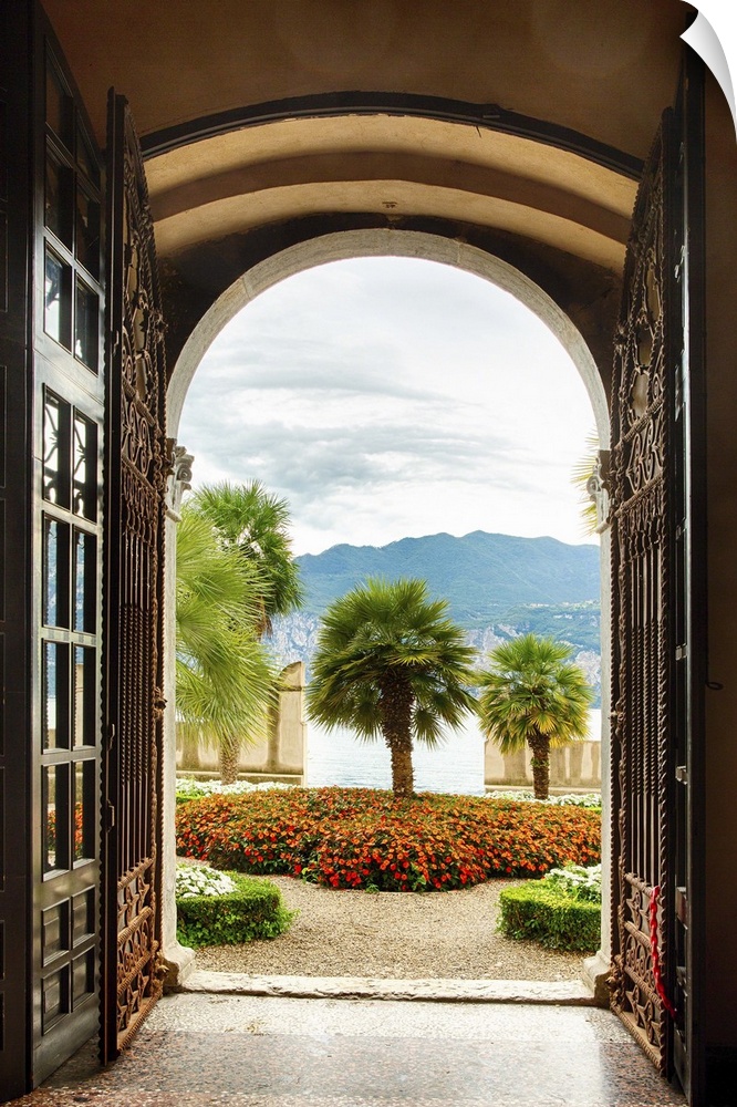 A photograph looking out to a garden from an open door.