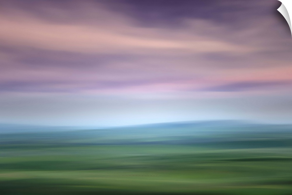 Long exposure image of the Palouse hills with a lavender sky.