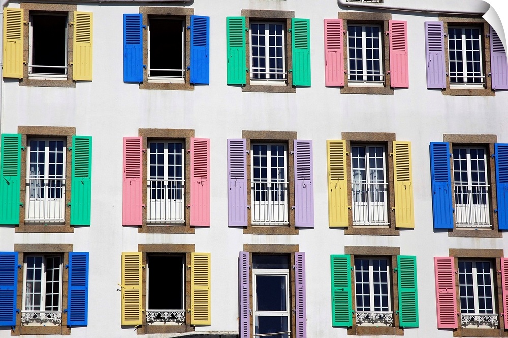Multi-colored windows of an hotel white wall in France in Quiberon, Brittany, graphic set.