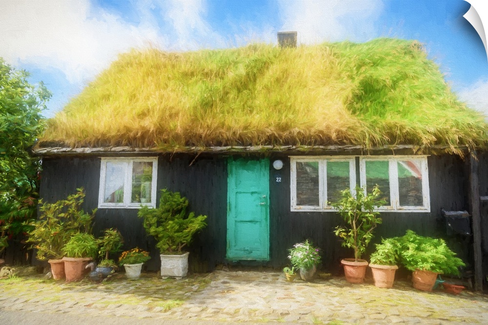 A black house with a turquoise door with a grassy roof.