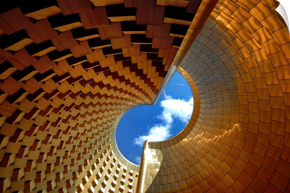 Inside the chimney of Vulcania theme park in France, representing a golden industrial volcano.