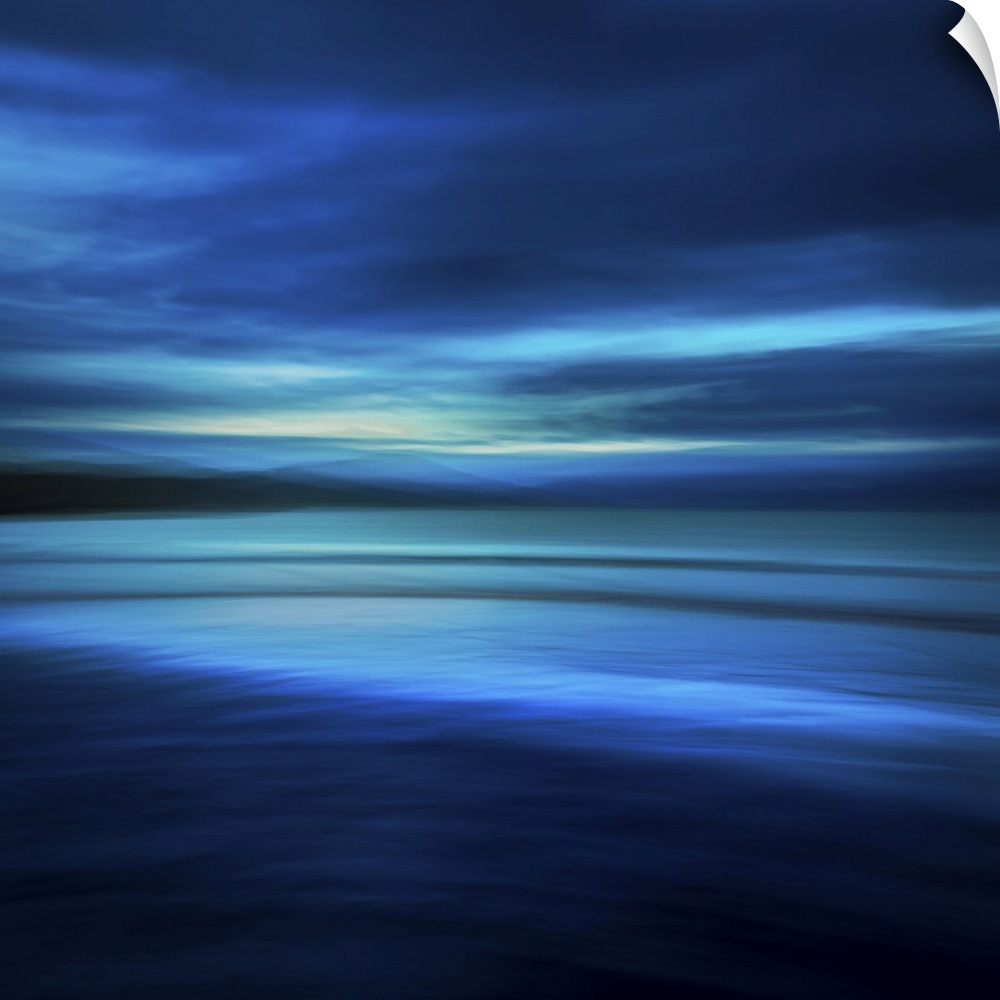 Blue abstract seascape on a deserted beach at midnight in shades of navy blue and aqua.