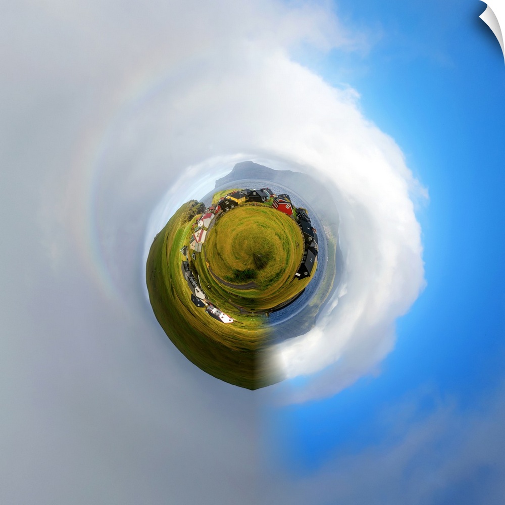 A red barn on green farmland, with a stereographic projection effect on the image, resembling a tiny planet.
