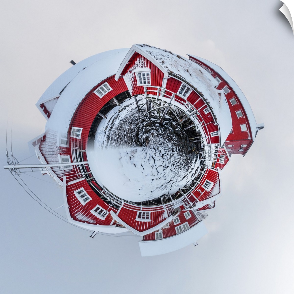 A large red barn after a recent snowfall, with a stereographic projection effect on the image, resembling a tiny planet.