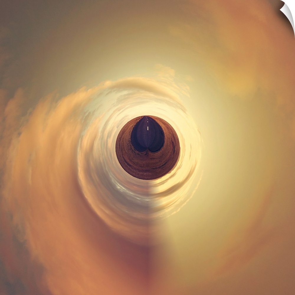 A road under a sky glowing orange at sunset, with a stereographic projection effect on the image, resembling a tiny planet.