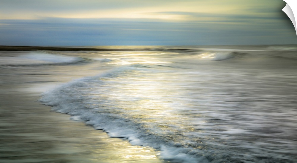A creative long exposure of the waves on the beach.