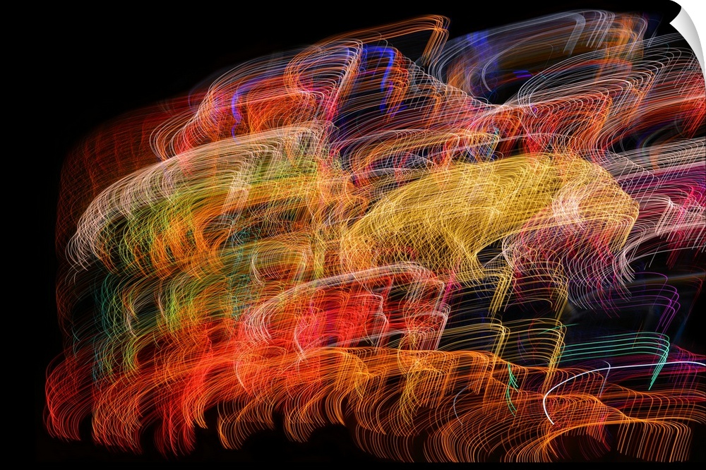 Abstract image created by a long exposure of moving lights.