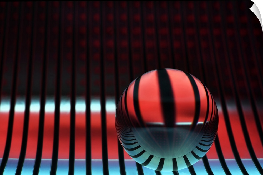 Abstract photo of a glass sphere reflecting stripes of light.