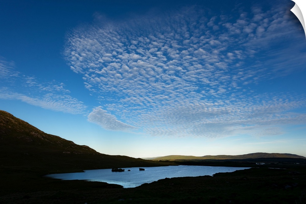 Cloudy blue sky over a lake in Ireland