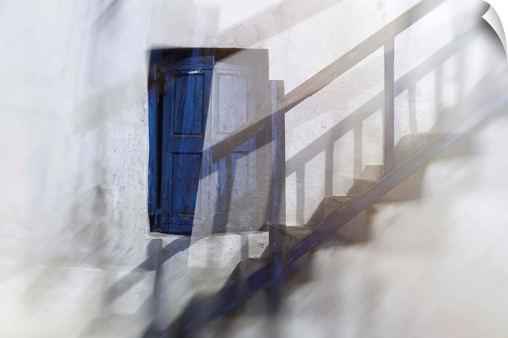 Ghostly image of a blue shuttered window along a set up steps with the shadow of the railings running up the wall.