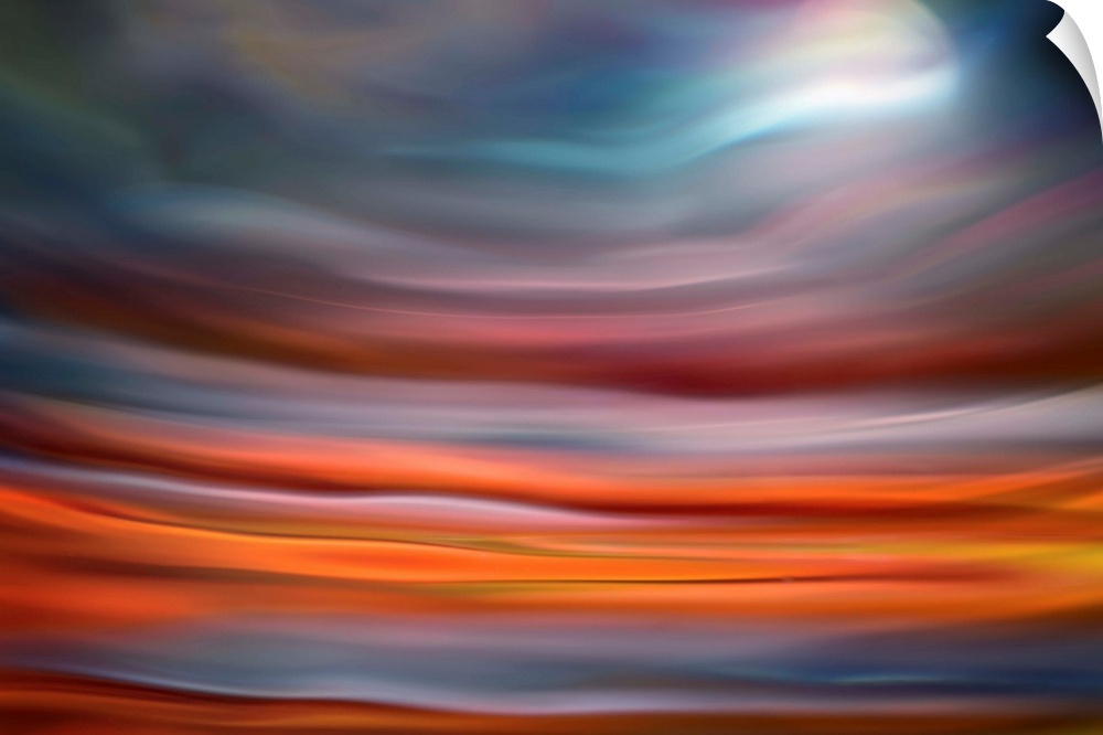 Abstract photo of smooth waves in warm colors, resembling the moon rising over the ocean.